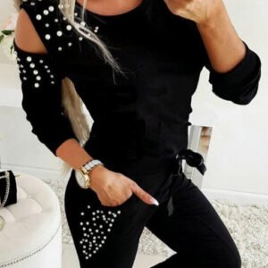 a set with a blouse and pants with pearls