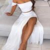 a set with a maxi skirt and a top revealing arms