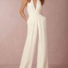 a suit with a deep neckline in the shape of the letter v and rapped pants 2