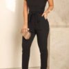 a suit with a neckline in the shape of the letters v and frills at the sleeves