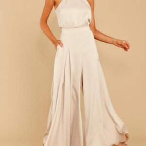 a suit with wide pants and a neck top on the neck