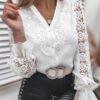 blouse for buttons with lace bell sleeves and lace application