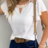 blouse with a short sleeve with frills at the sleeves and decorative buttons on the neckline