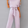 cut suit with a bat cut and binding at the waist 5