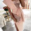 dress with an asymmetrical gora with sequins