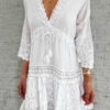 dress with lace inserts and tassels