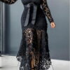 lace dress with a decorative ribbon at the waist