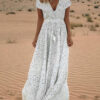 maxi dress with a deep neckline and tassels