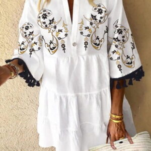 mini bitch with stitching and tassels at the sleeves