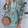 tunic dress with a neckline in the shape of the letters v